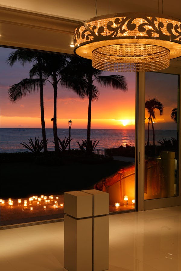 Looking out from chapel to sunset with candles.