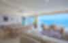 Living and dining rooms with large ocean view