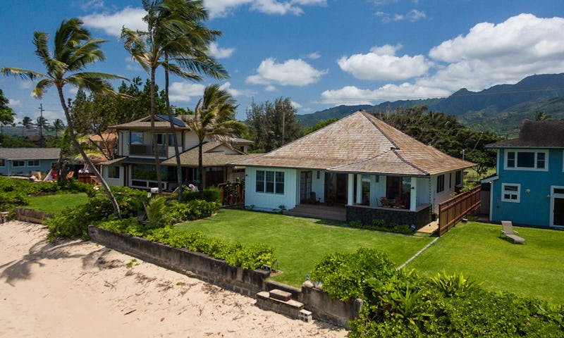 Exterior photo of house showing beachfront access