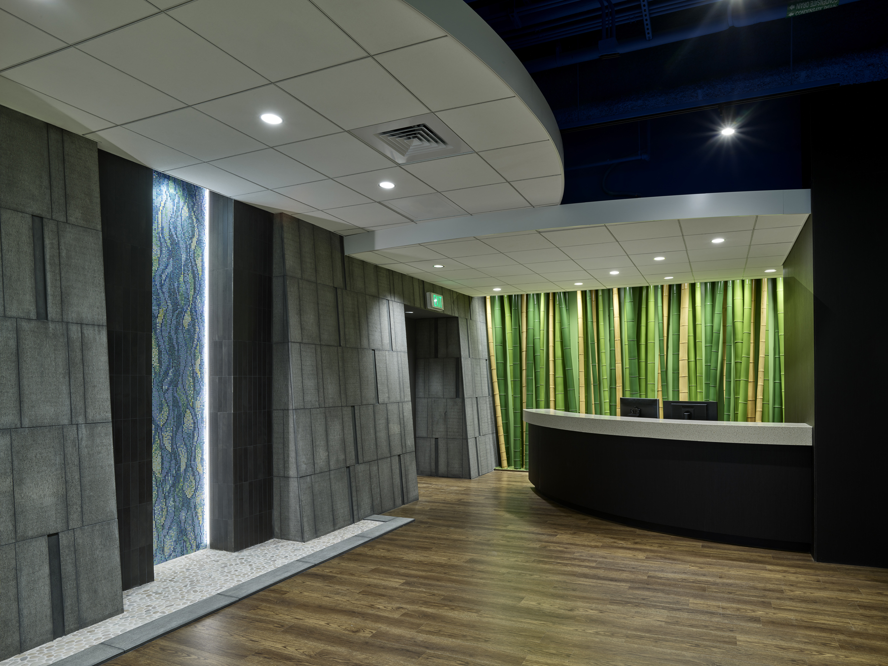 Entry desk with green bamboo and stone walls