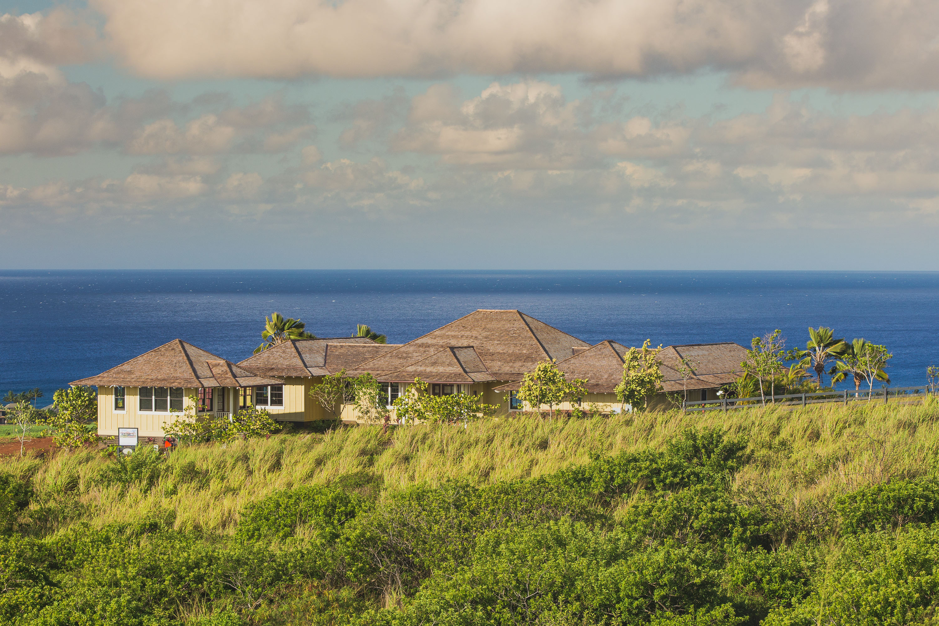 Wide shot of residence with ocean view.