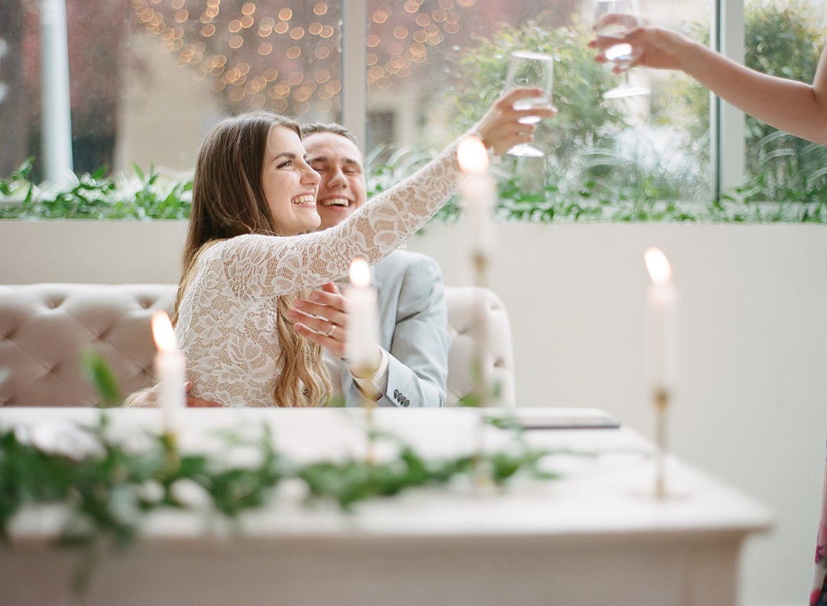 Film wedding photography couple toasting after speeches