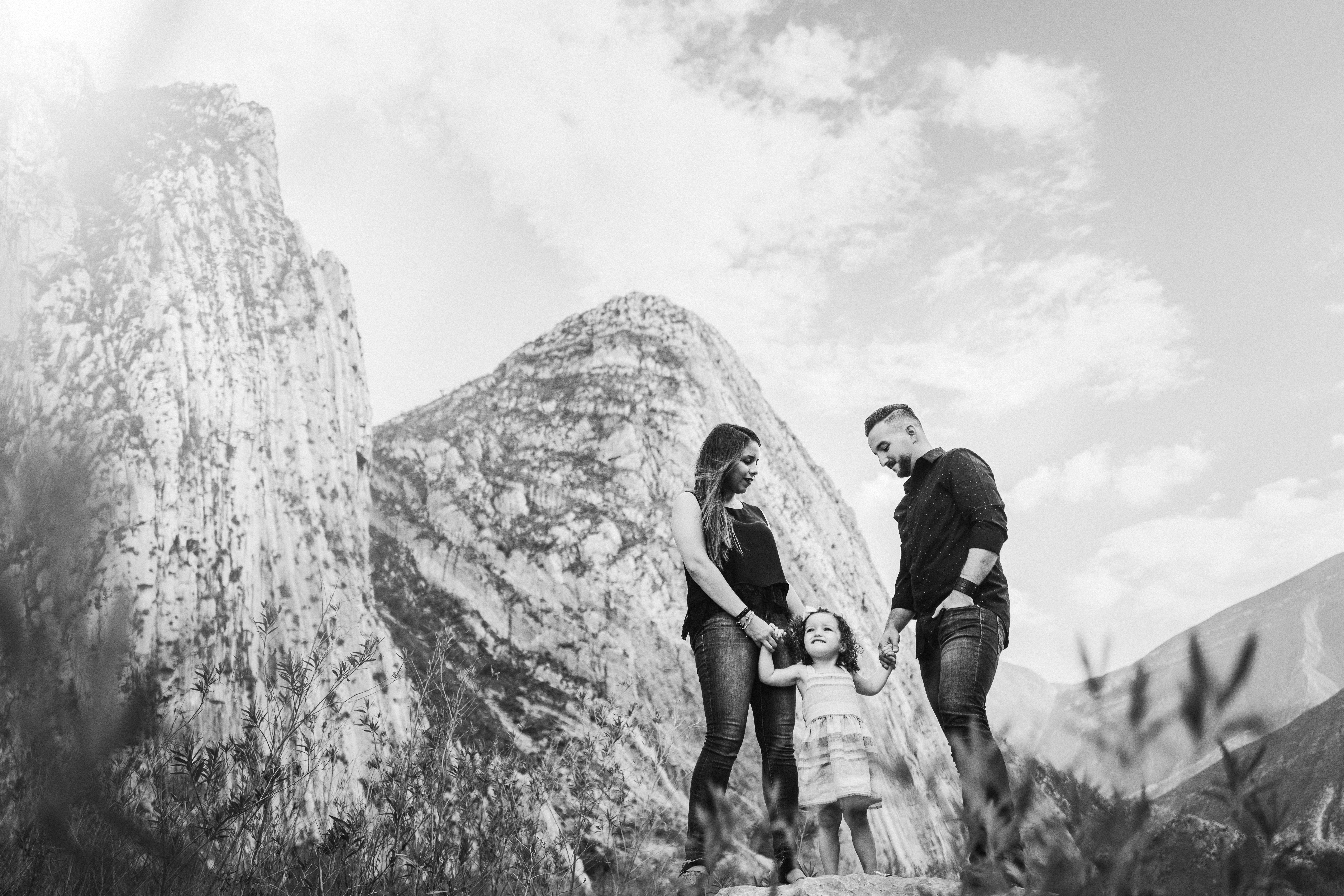 Fer Juaristi Photography shot on film Leica camera young family in front of mountains in black and white