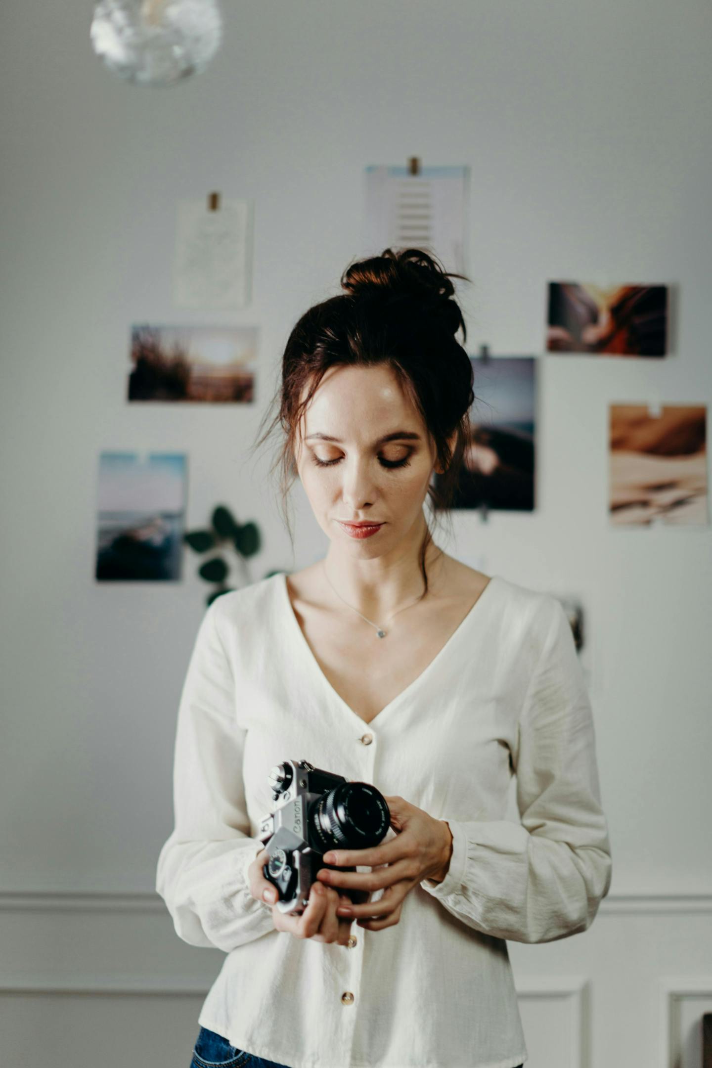 Female photographer looking at the best camera for wedding photography