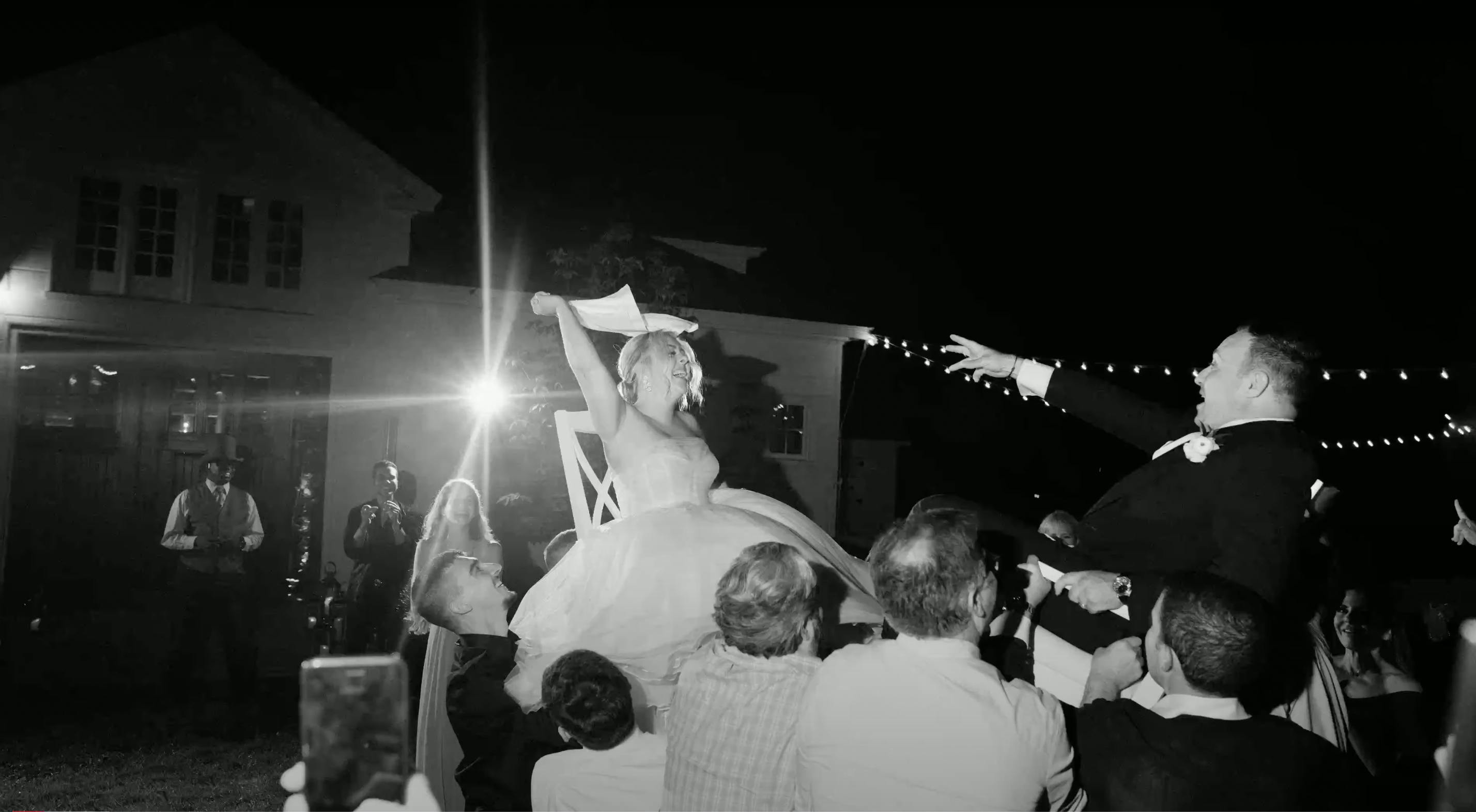 Adonye Jaja black and white photograph of a bride enjoying her wedding party