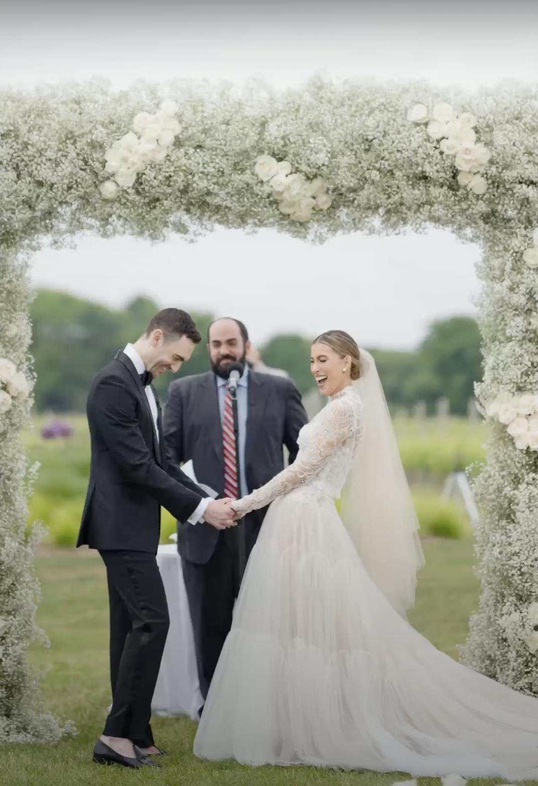 Adonye Jaja photograph of a bride and groom at a flower-covered alter