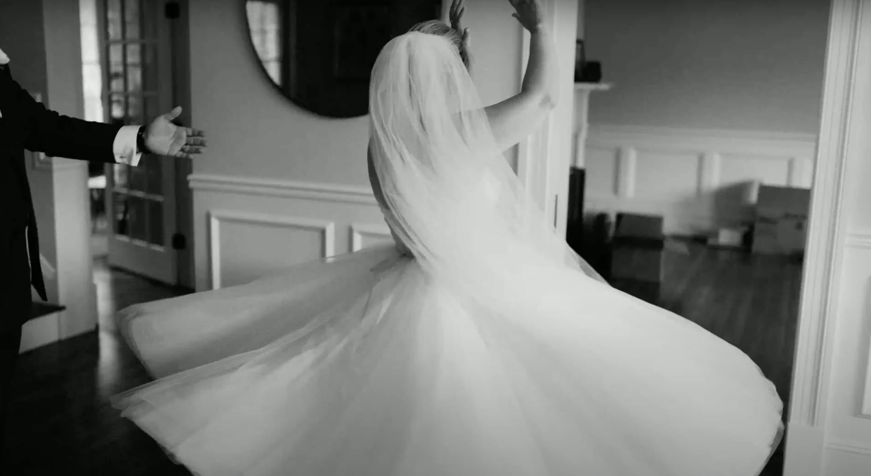 Adonye Jaja black and white photograph of a bride dancing in her wedding dress