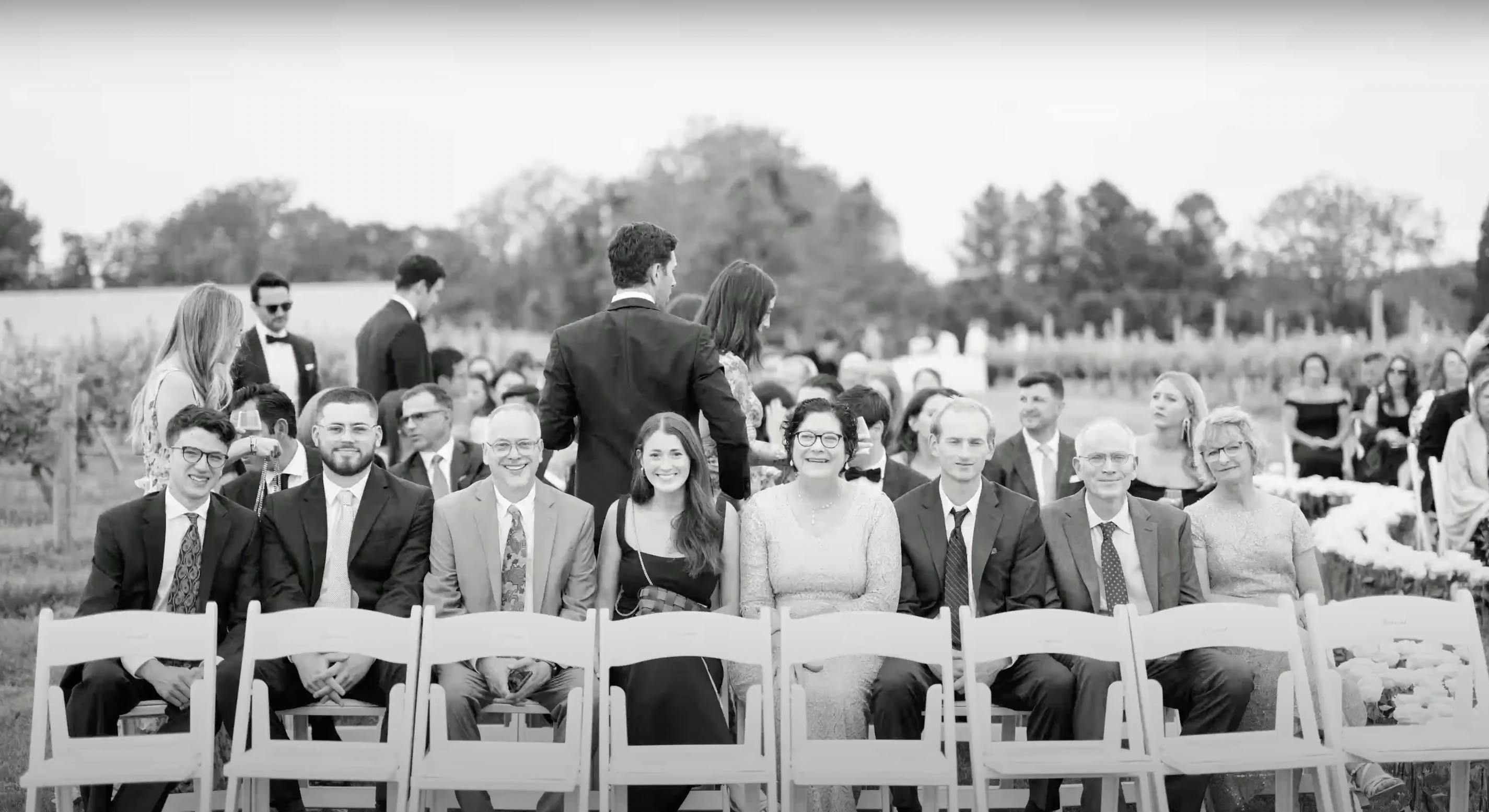 Adonye Jaja black and white photograph of wedding guests seated in a row