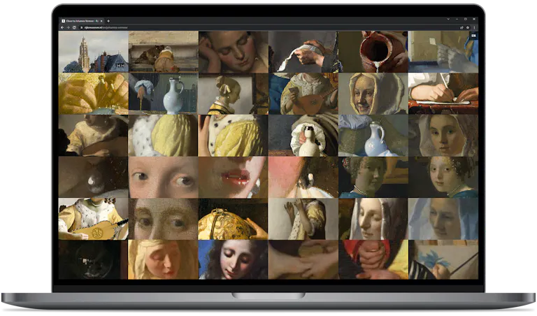 Laptop met de online Vermeer-tentoonstelling op rijksmuseum.nl