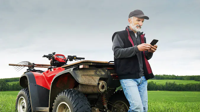 Farmer with small tractor working on the land