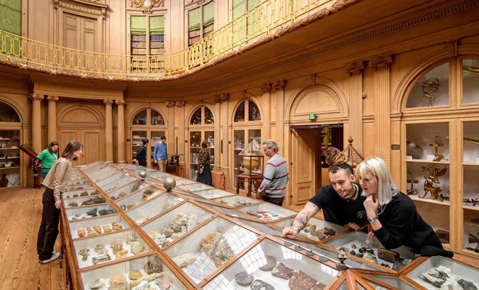 Visitors to Teylers Museum in the Oval Hall