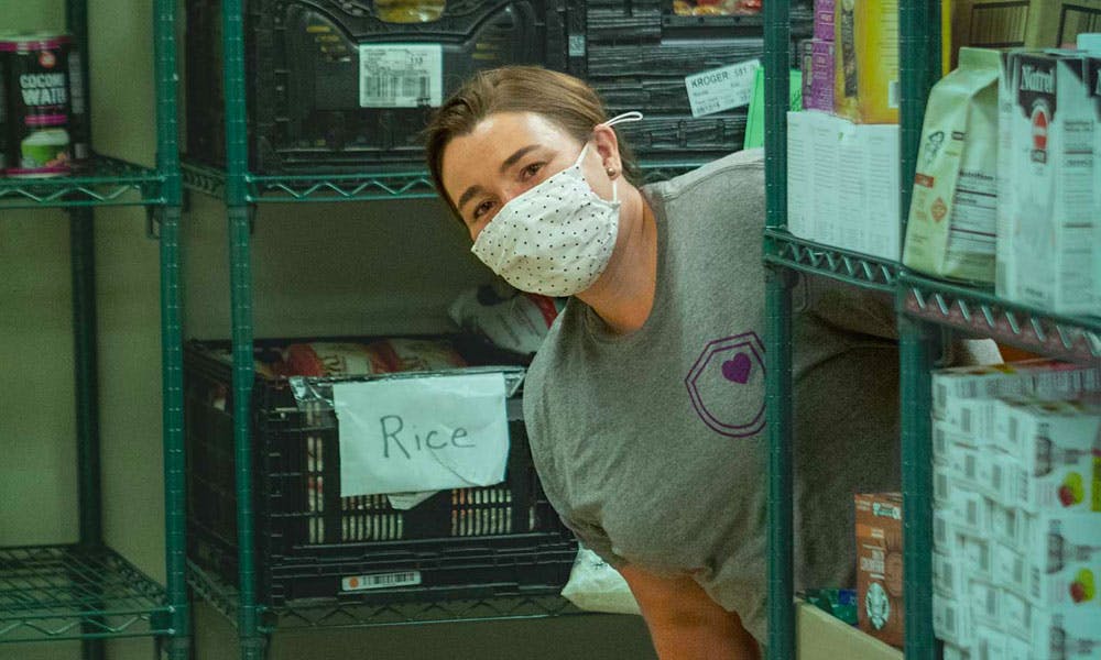 Employee smiling at a food bank