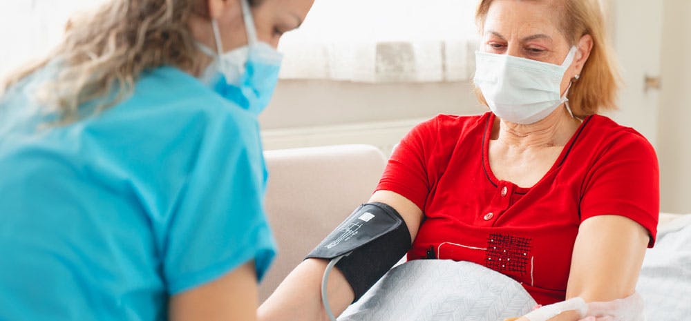 a patient getting their blood pressure checked.