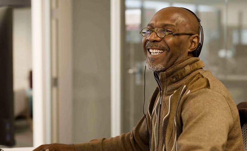 Warrior speaking to a member and smiling