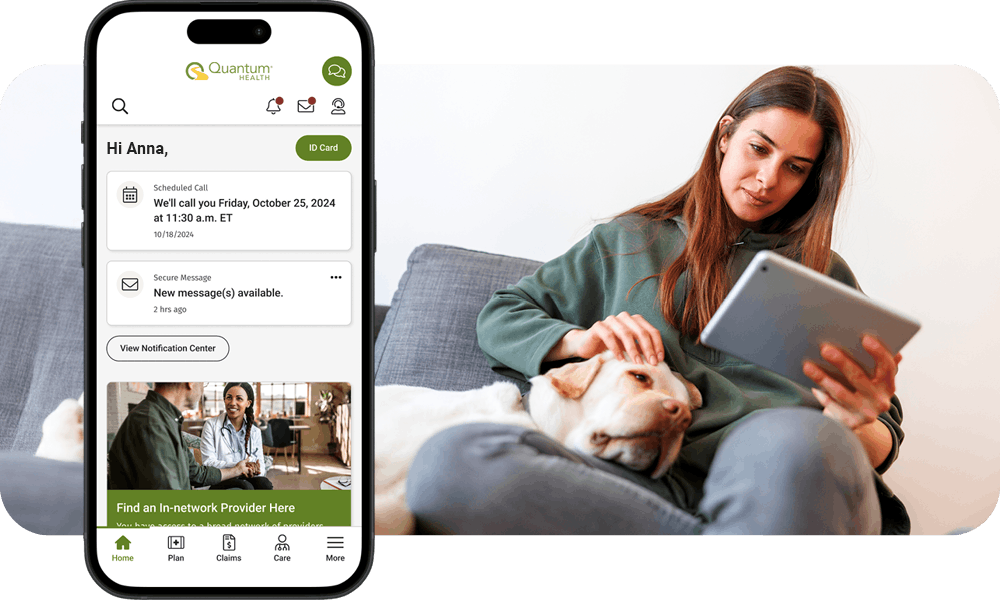 Woman sitting on couch viewing iPad while petting her dog