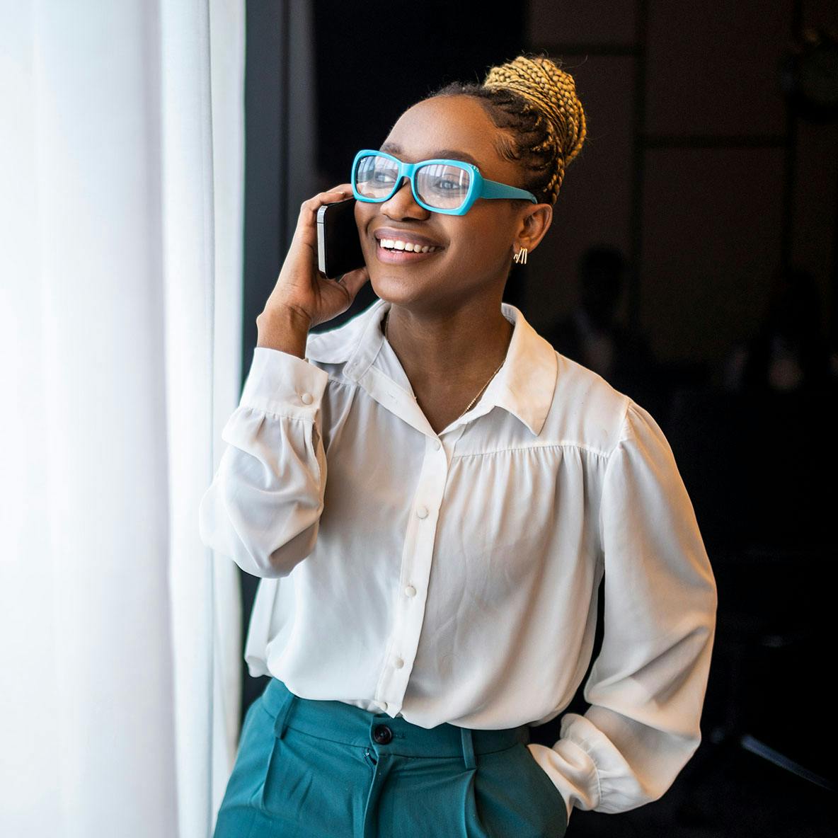 Woman talking and smiling on mobile phone