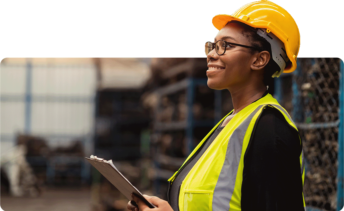 woman in construction hat and yellow safety vest