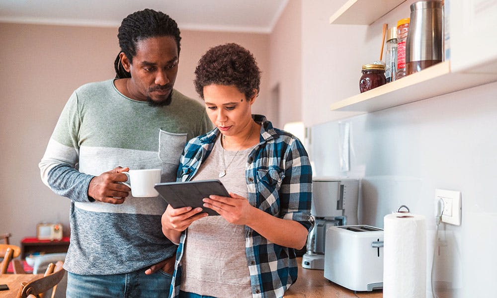 Couple looking at tablet computer