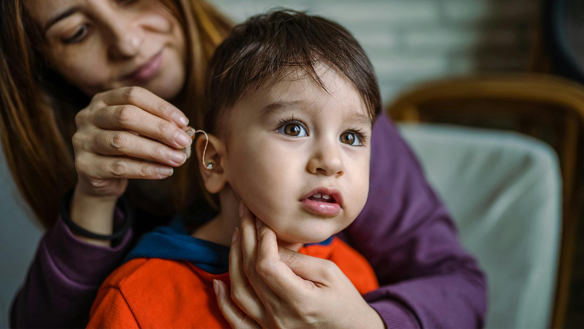 Baby with hearing aid