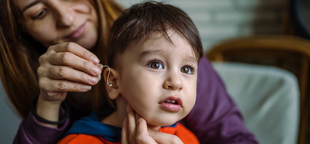 Baby with hearing aid