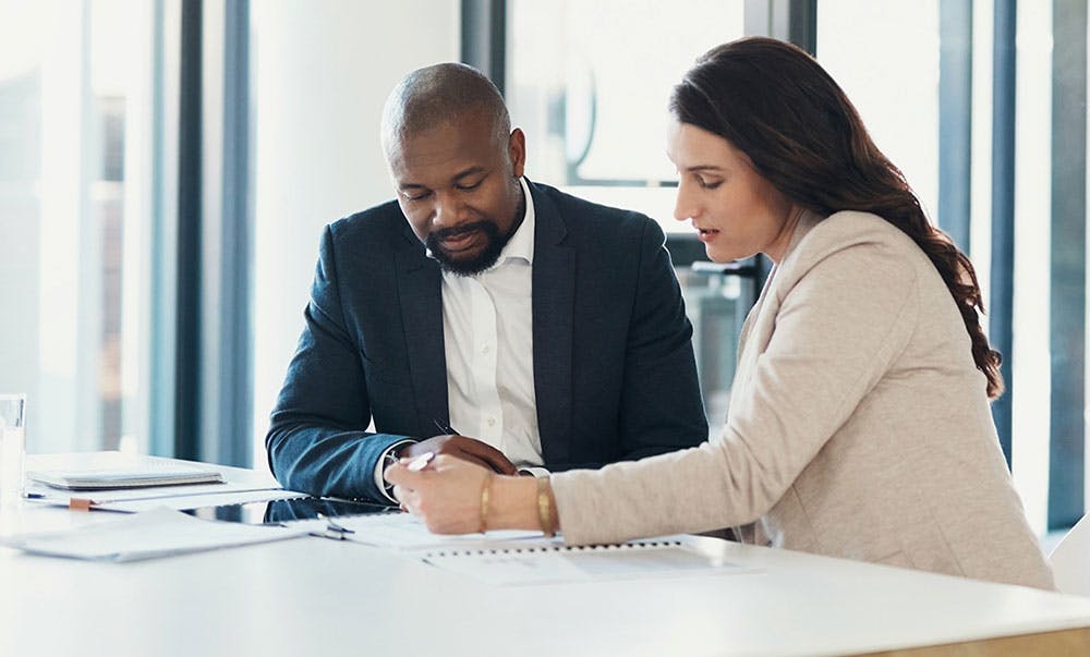 Coworkers working together on a contract or proposal