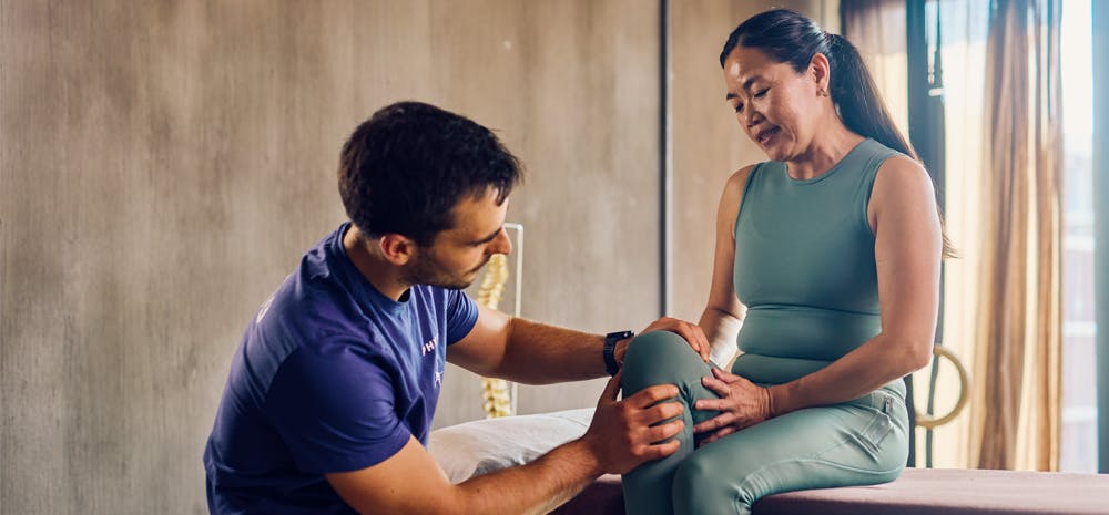 Knee doctor working with his patient