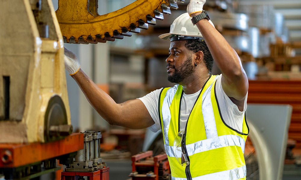 Darius working in his industrial job