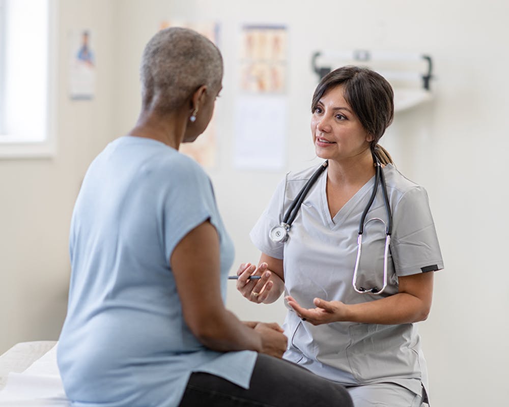 A doctor talking with her patient