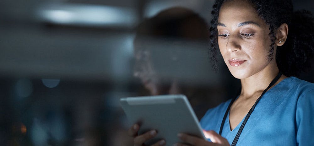 Nurse looking at tablet computer
