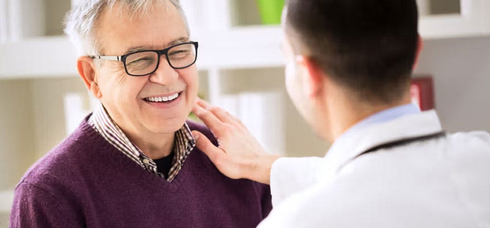 Doctor smiling with his patient