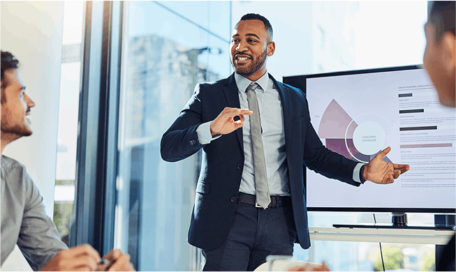 african american man presenting to a group in a meeting setting