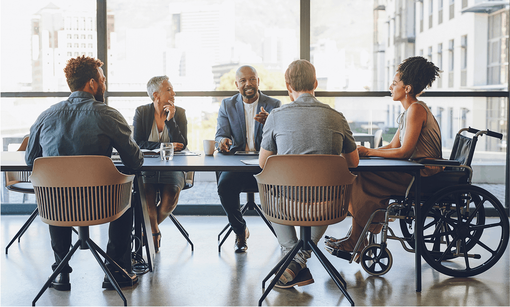 a diverse group of people in a meeting room