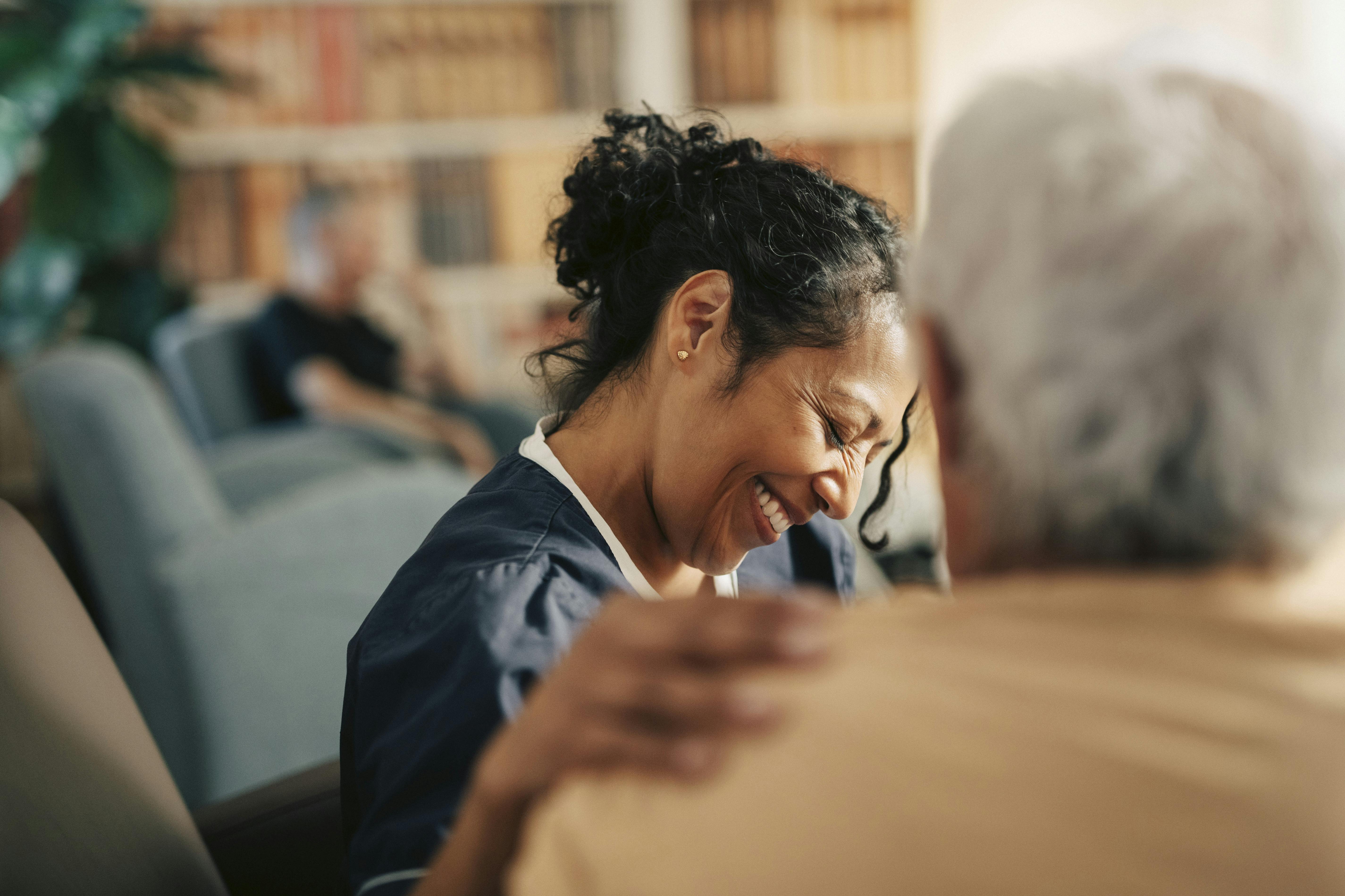 Happy woman putting her hand on a man's shoulder