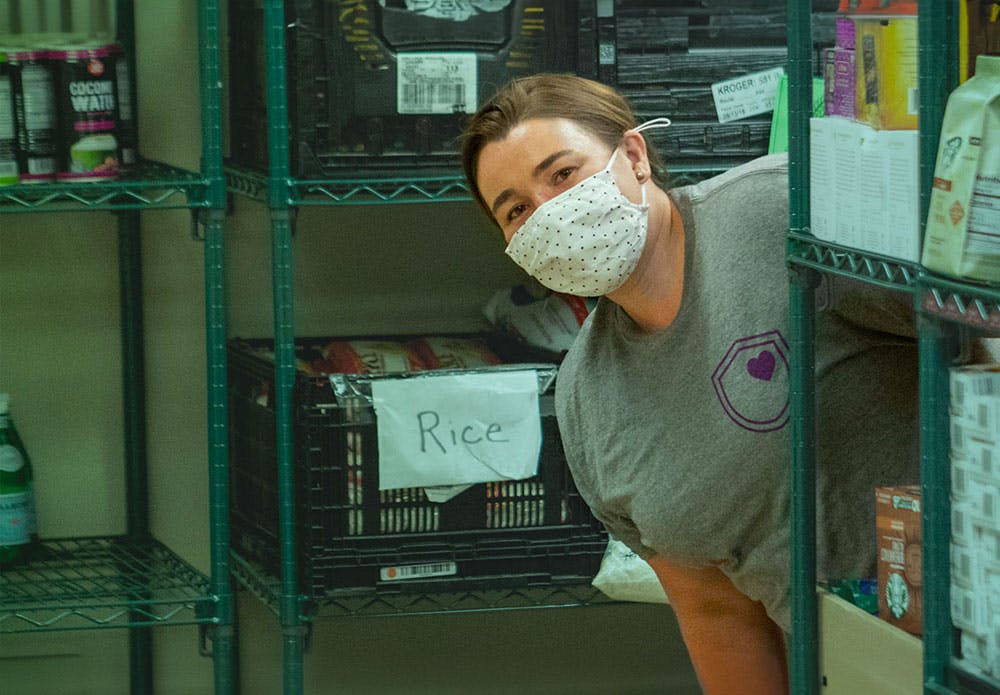 Employee smiling at a food bank