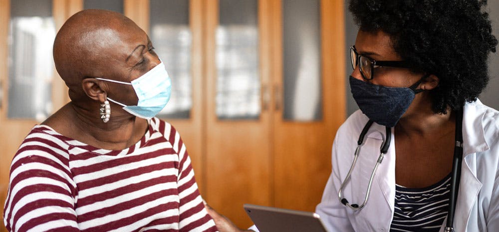 a doctor speaking with her patient 