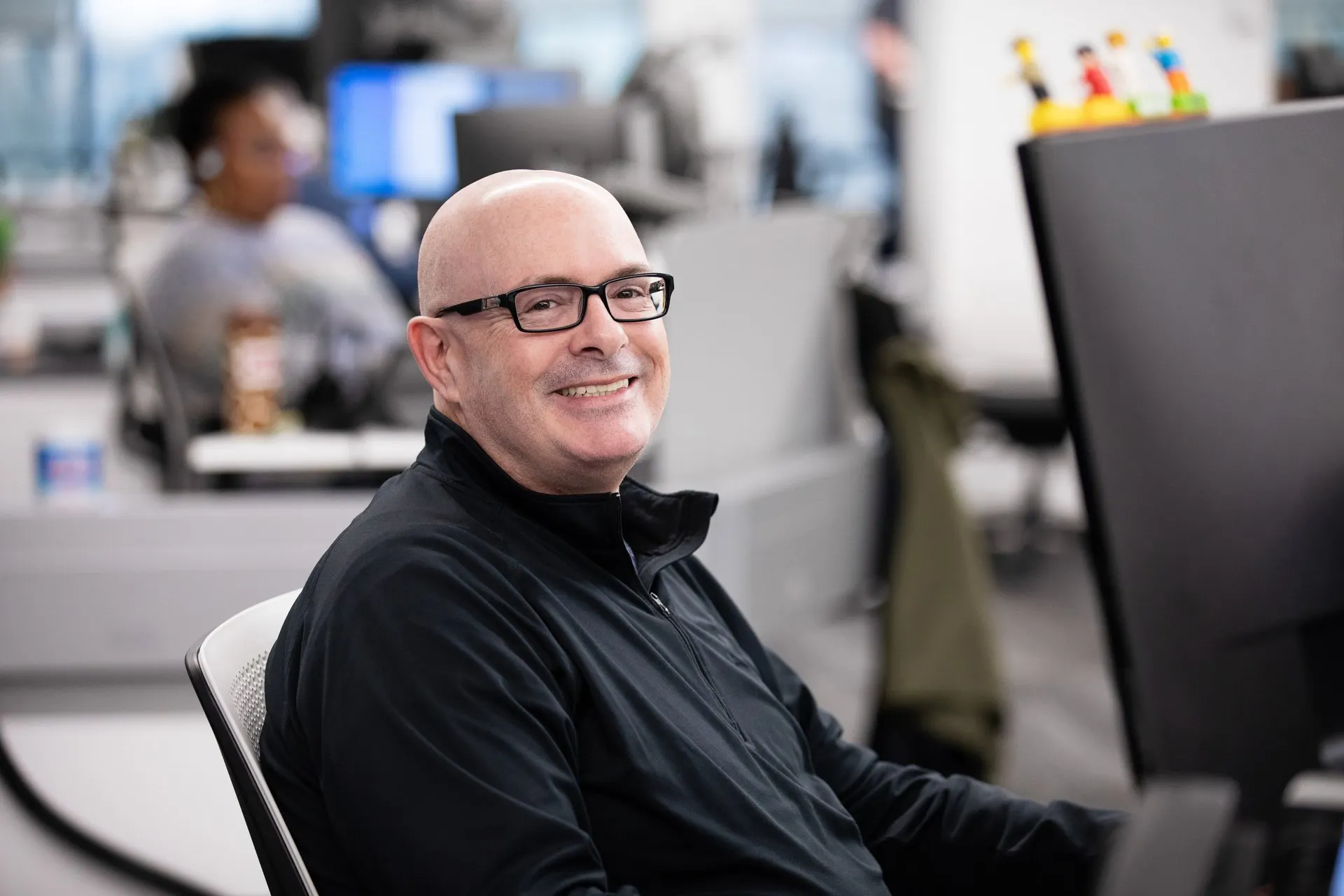 Male warrior smiling at desk