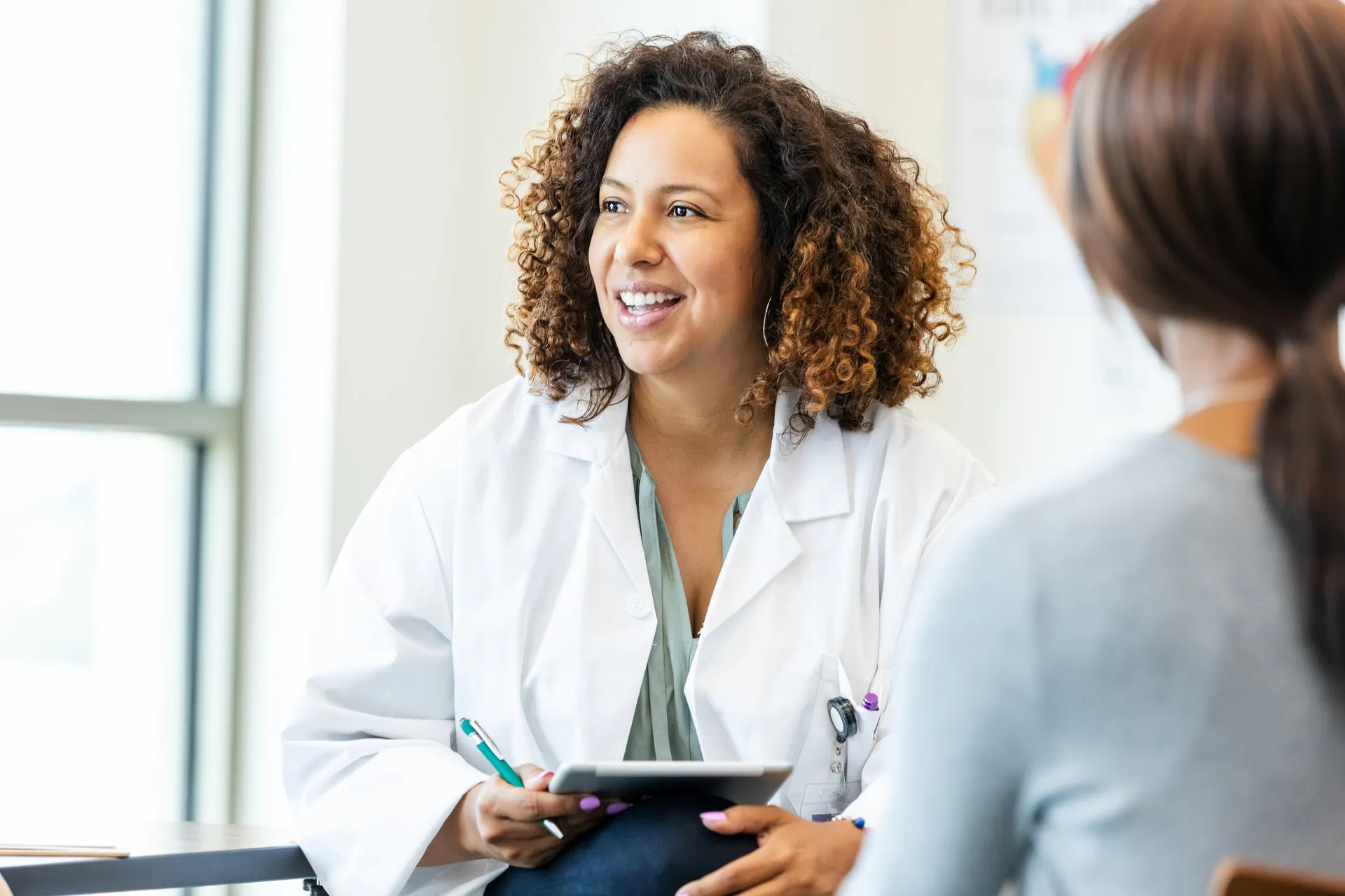 Doctor smiling with patient