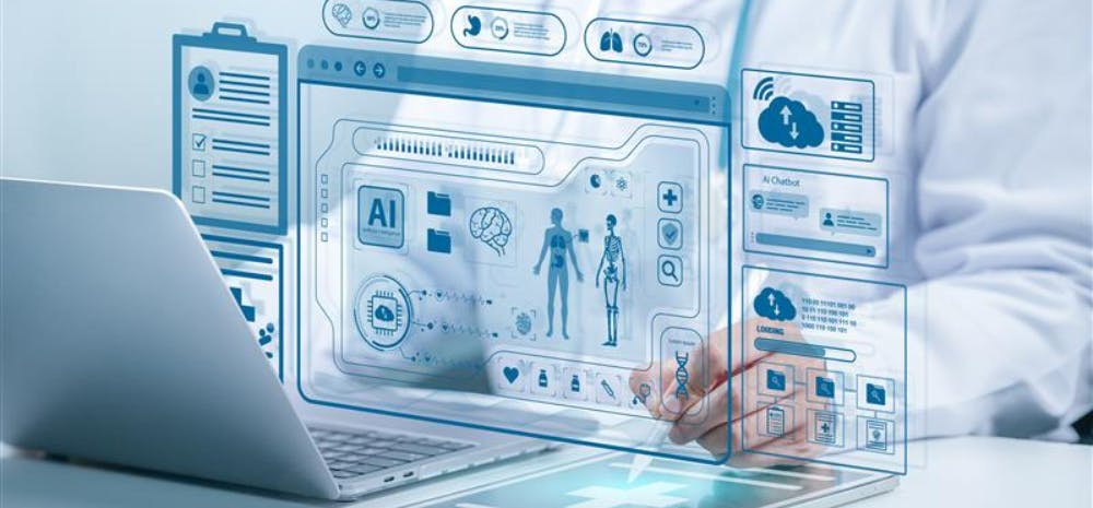 a doctor writes on a tablet in front of a laptop with health-related images above it