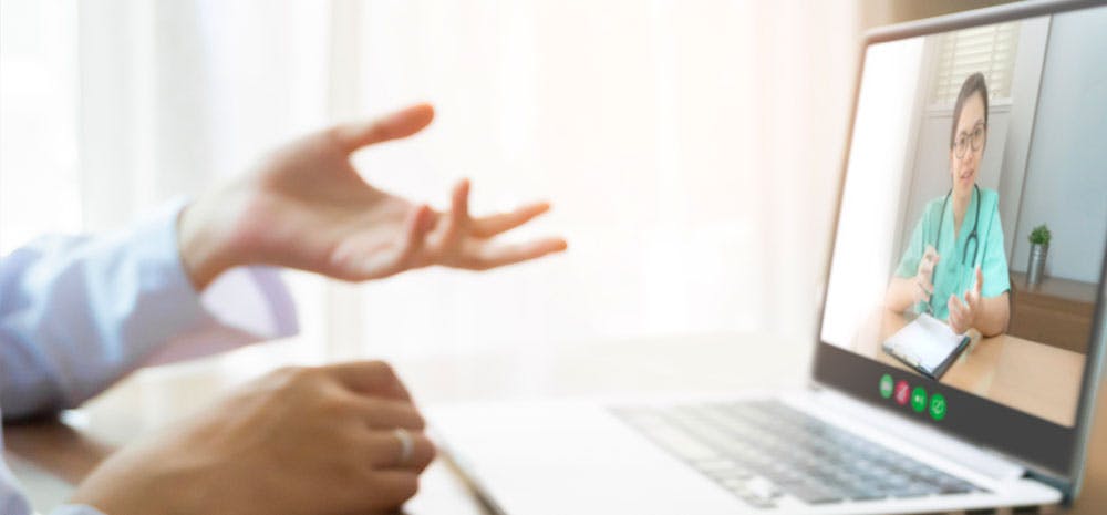 a patient meeting with their doctor virtually. 