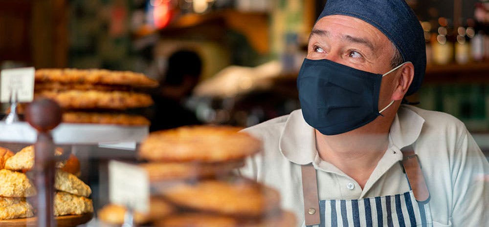 a chef staring off into space.