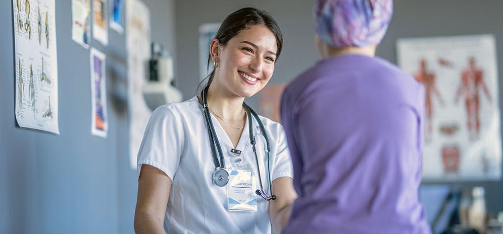 nurse with patient smiling