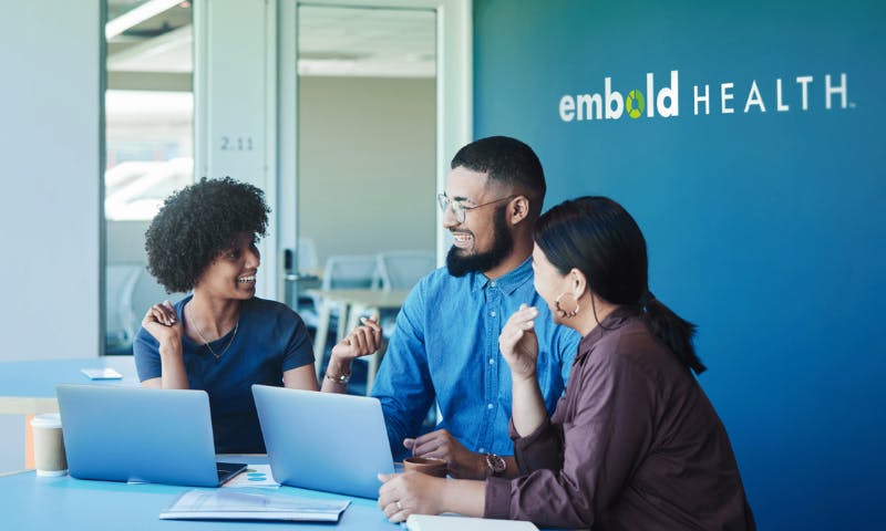 embold health employees collaborating at a computer