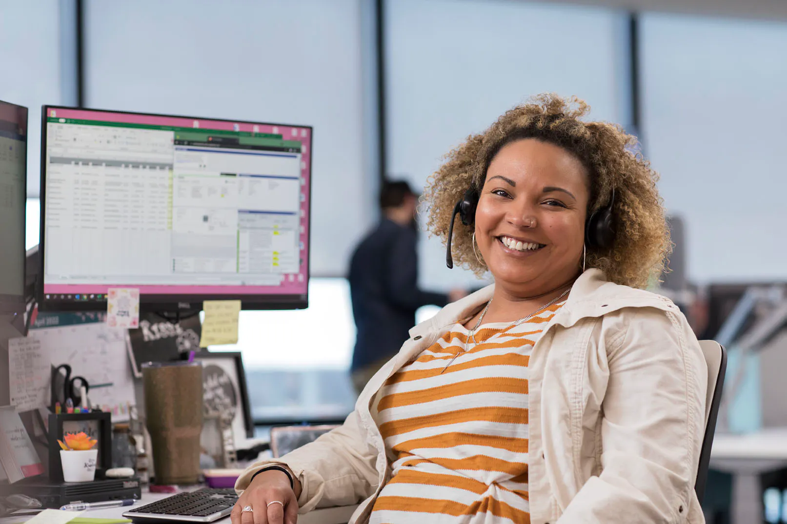Business operations staff smiling at desk