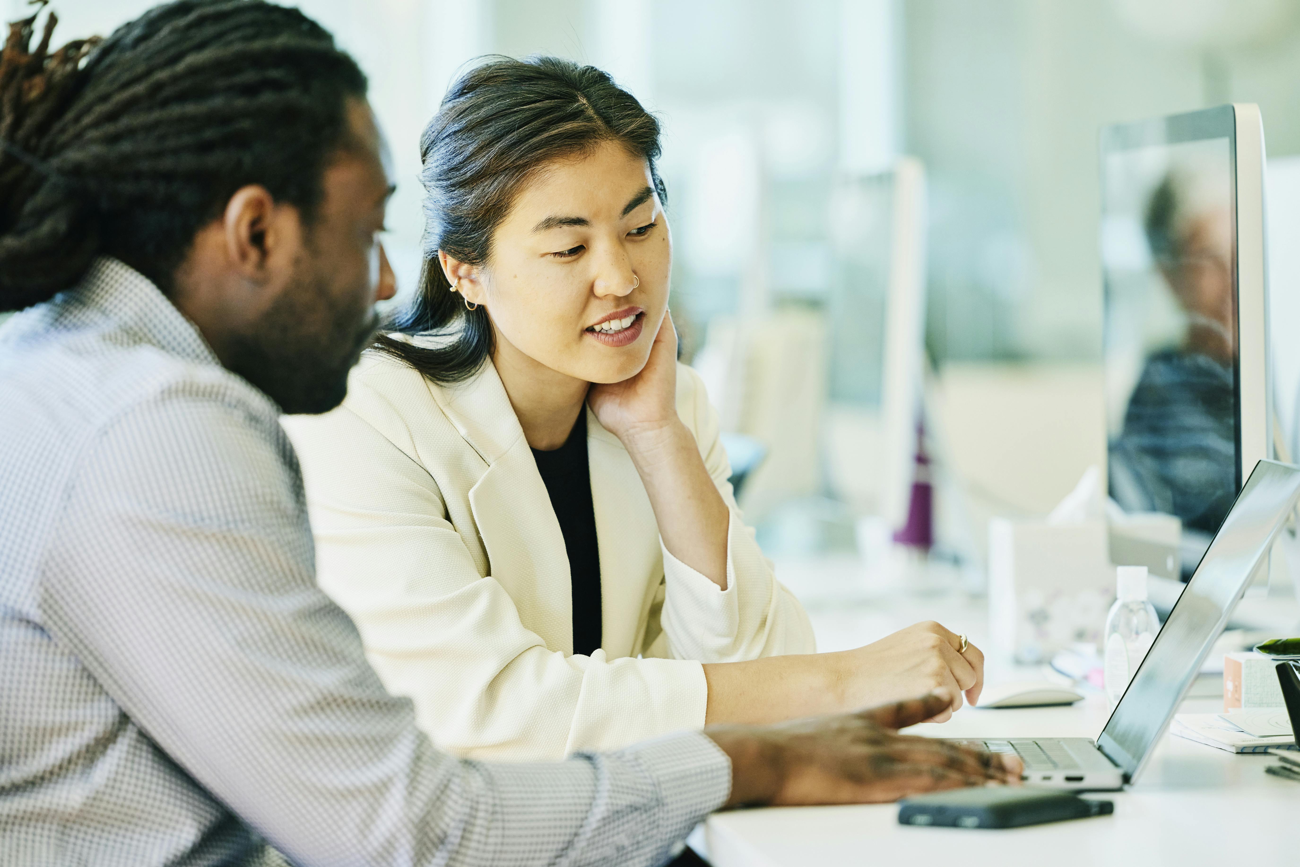 Man and woman at work on computer