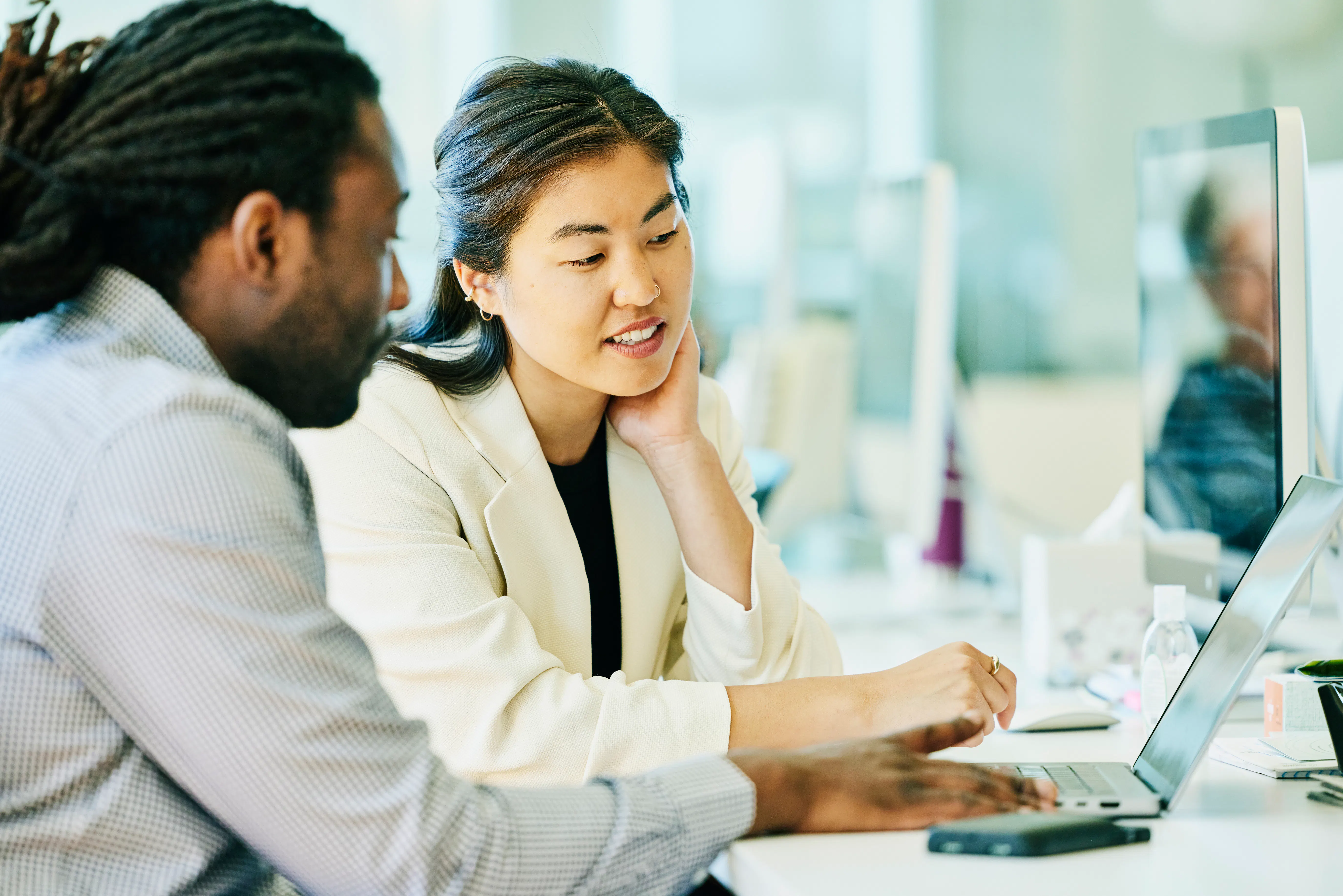 Man and woman at work on computer
