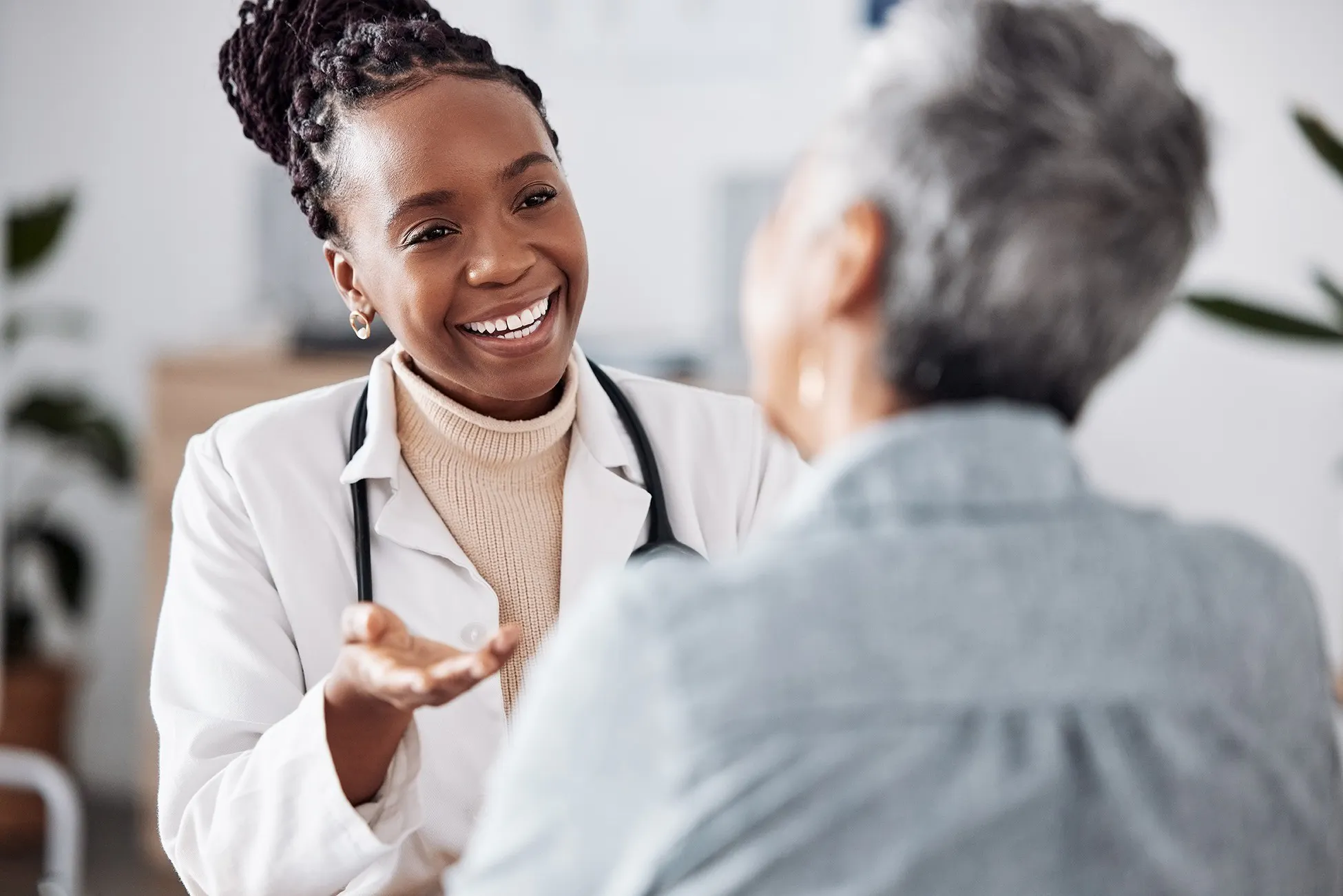 Female Doctor smiling at patient