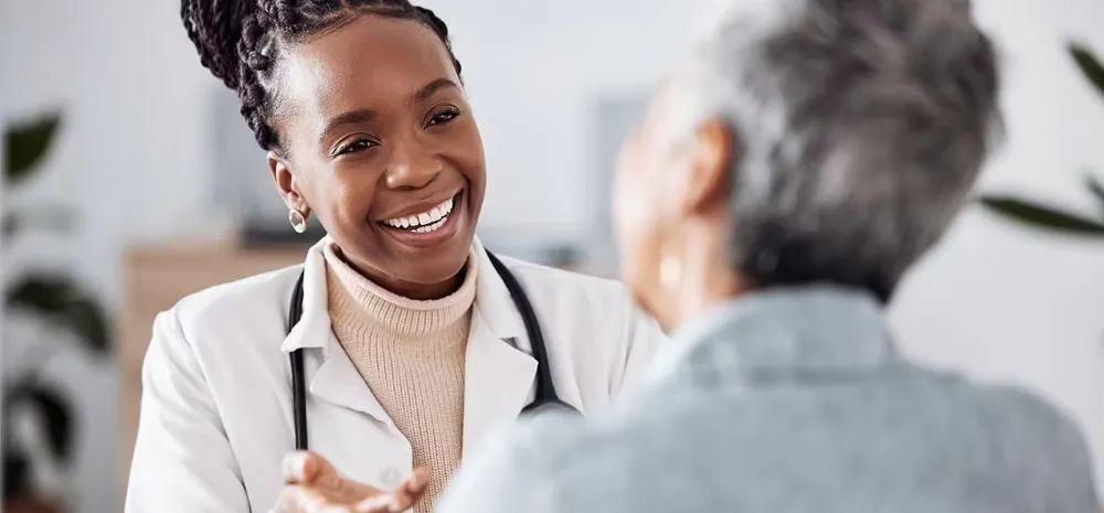 Doctor smiling with patient