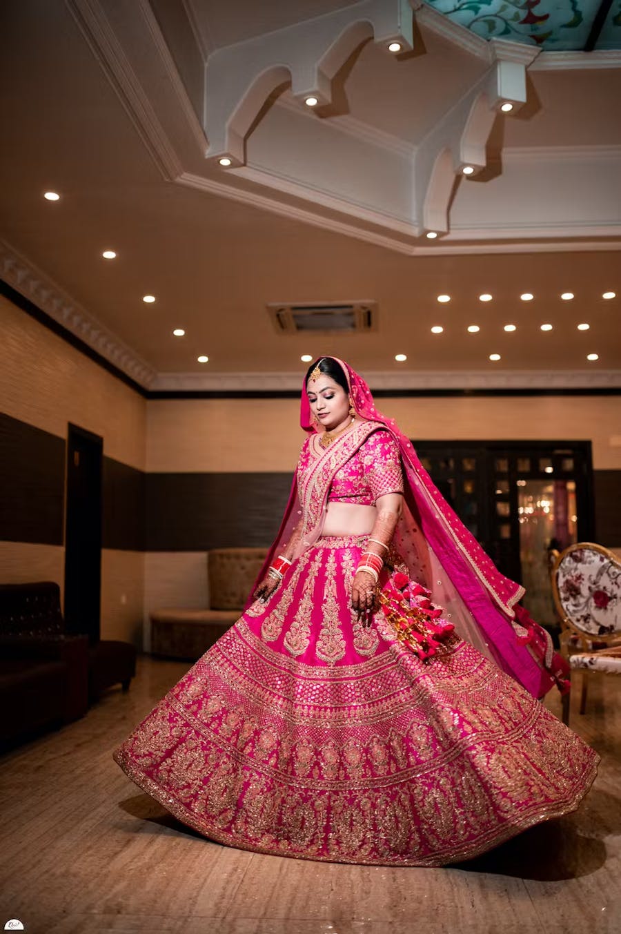 Bride swinging in pink lehenga