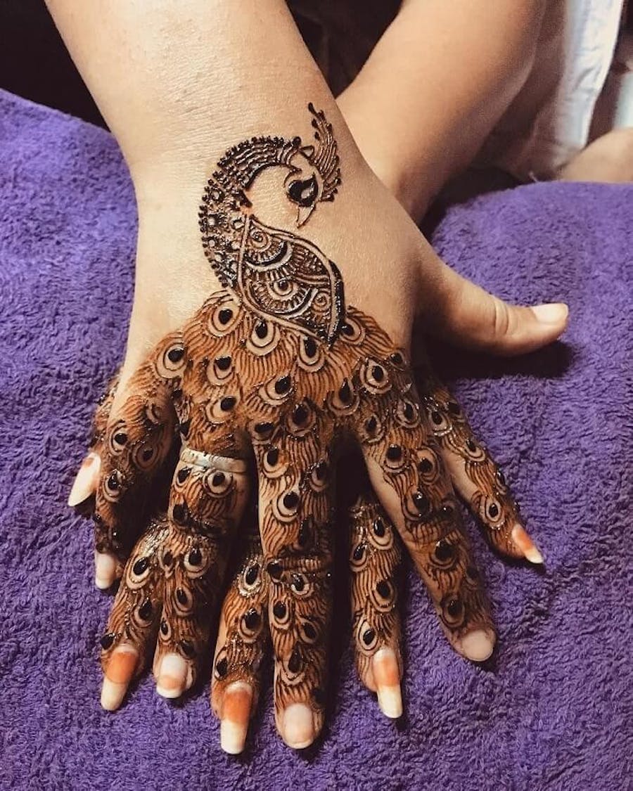 peacock pattern finger mehndi design