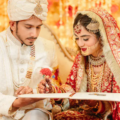 Couple signing wedding documents